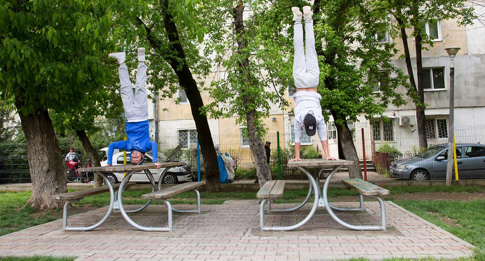Boys do handstands on table