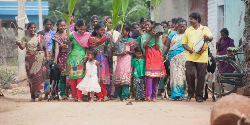 Villagers marching and playing music