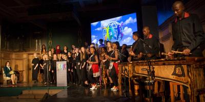 Children on stage singing