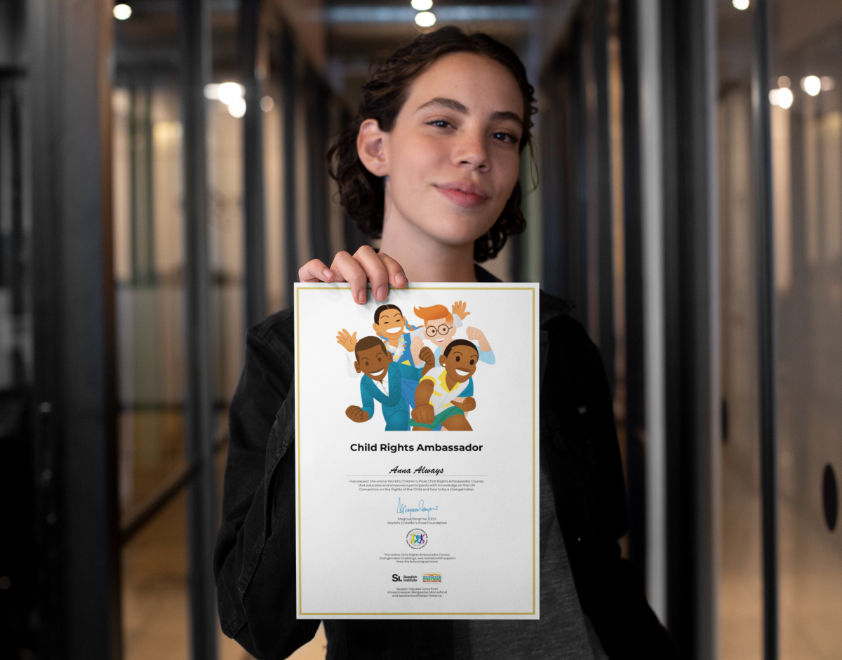 Girl holding diploma.