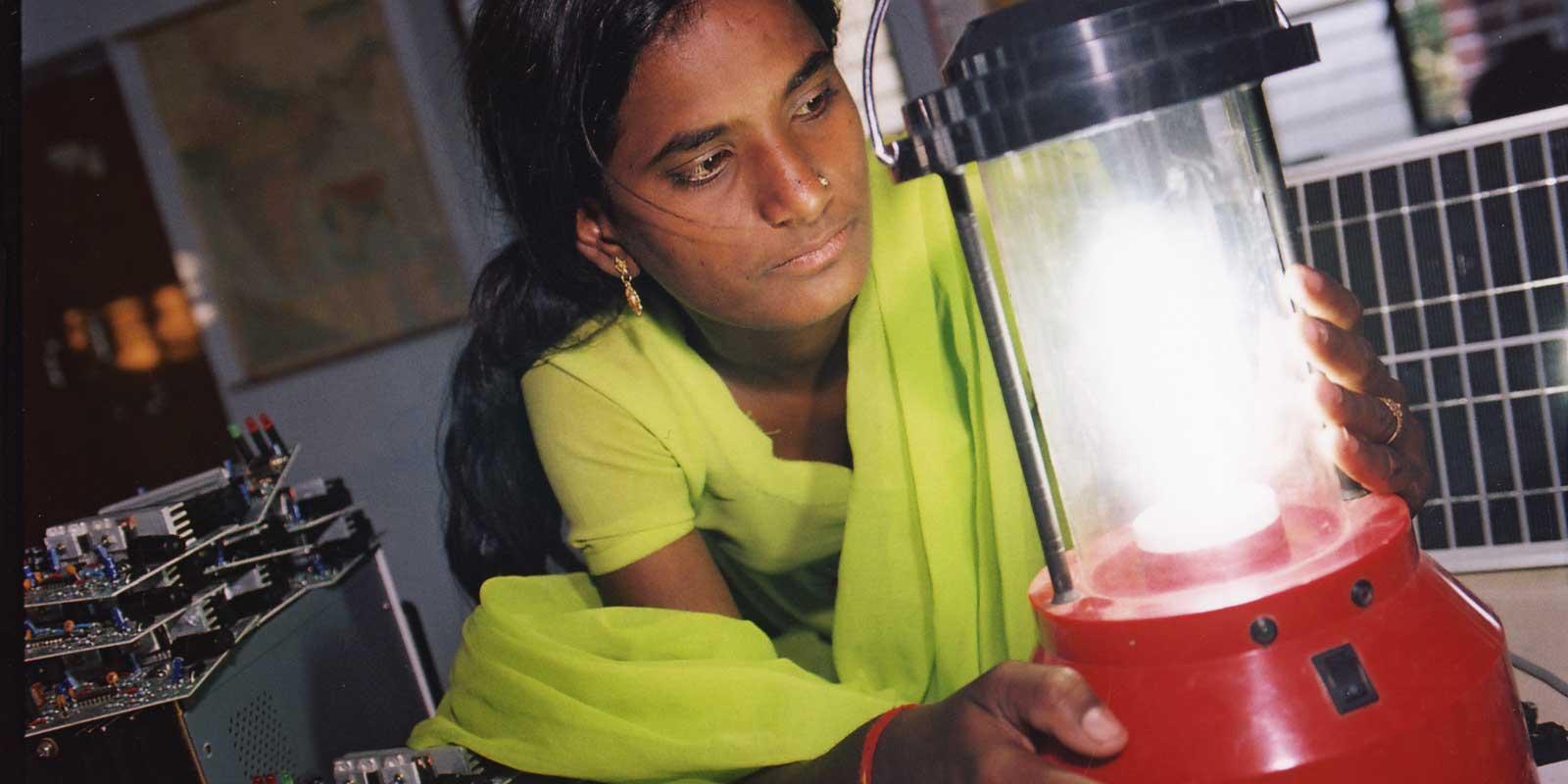 a girl with an electric light