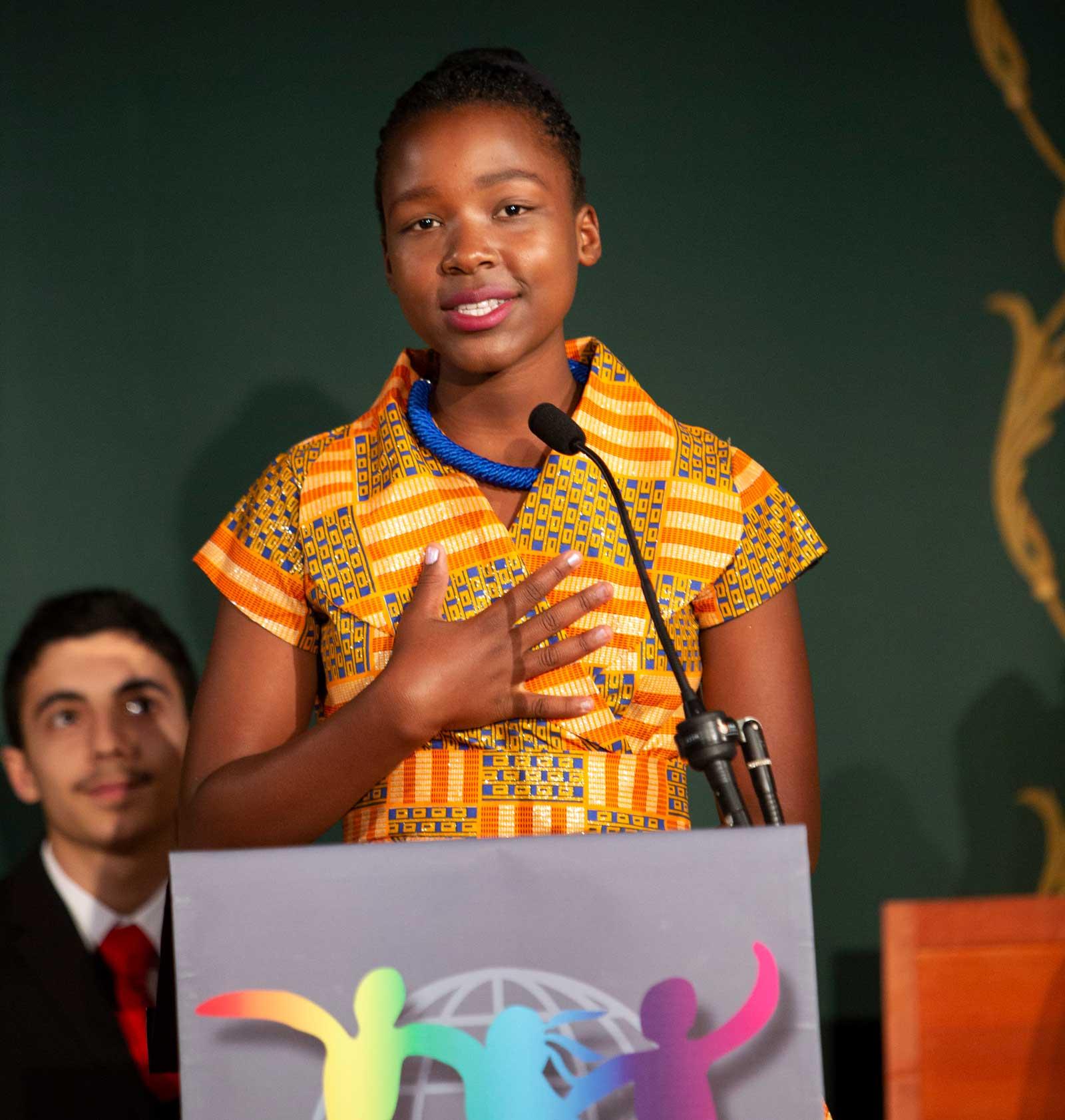 Kim speaking at ceremony