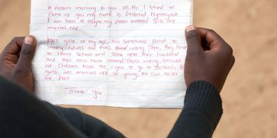 Hands holding a letter