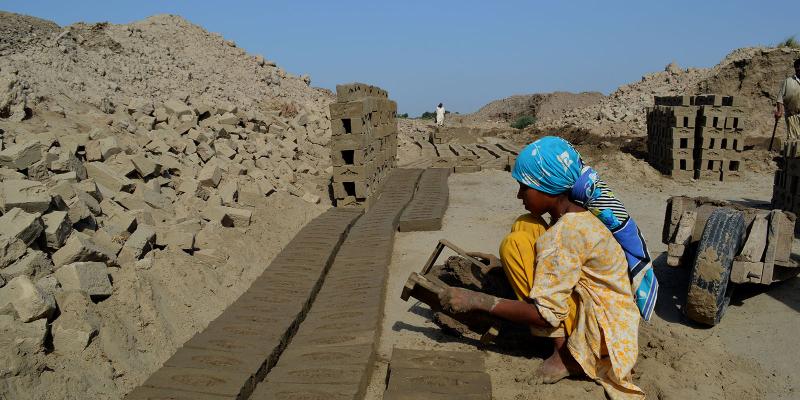 Nosheen making bricks under hot sun