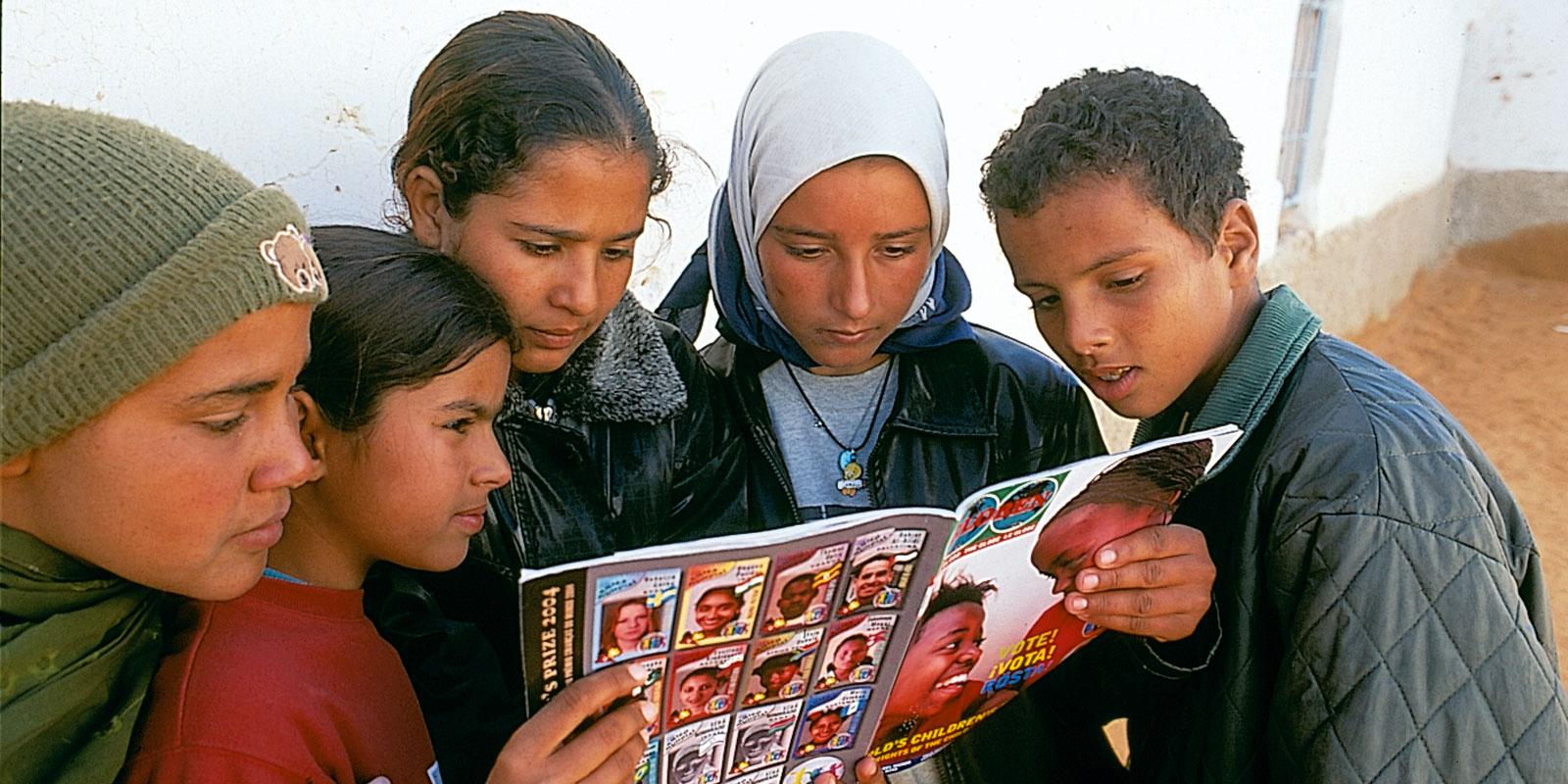 Children reading about Mandela in the Globe