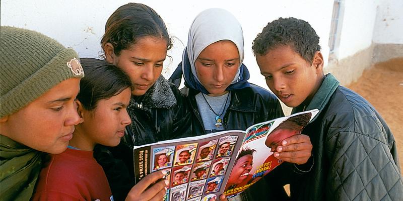 Children reading about Mandela in the Globe