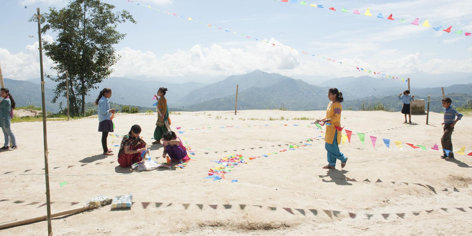 Children preparing a festive event in the mountains. 