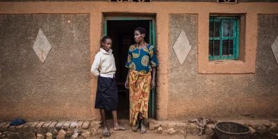 Two people in a doorframe.