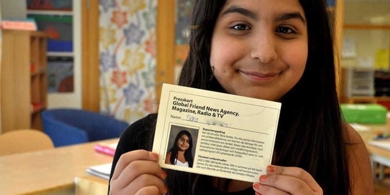 Girl with press card.