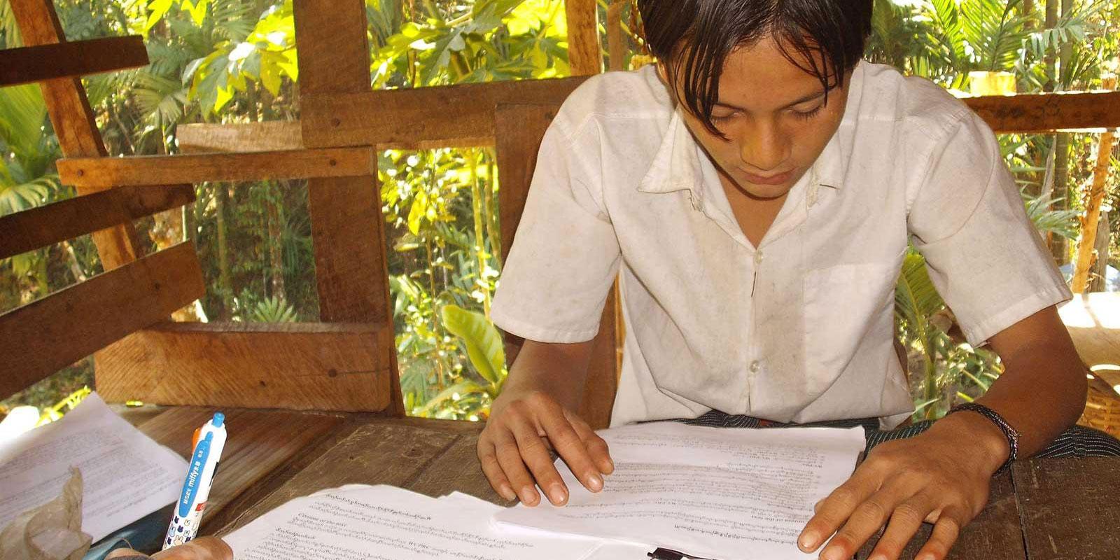 Boy sitting at desk working