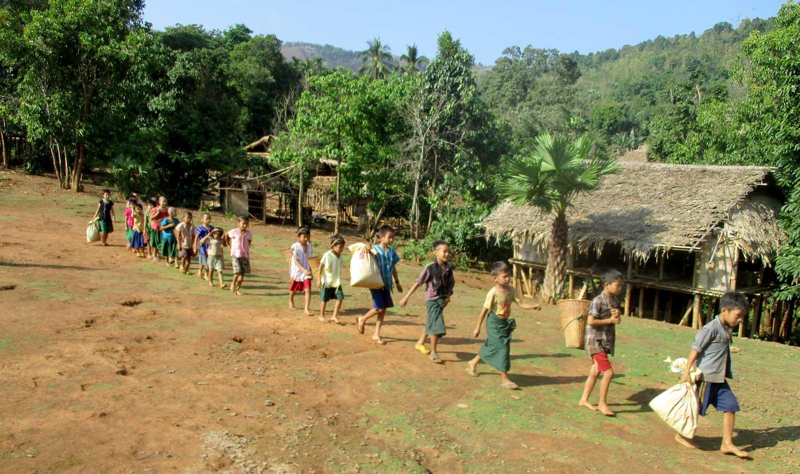 Group of kids on their way to collect trash