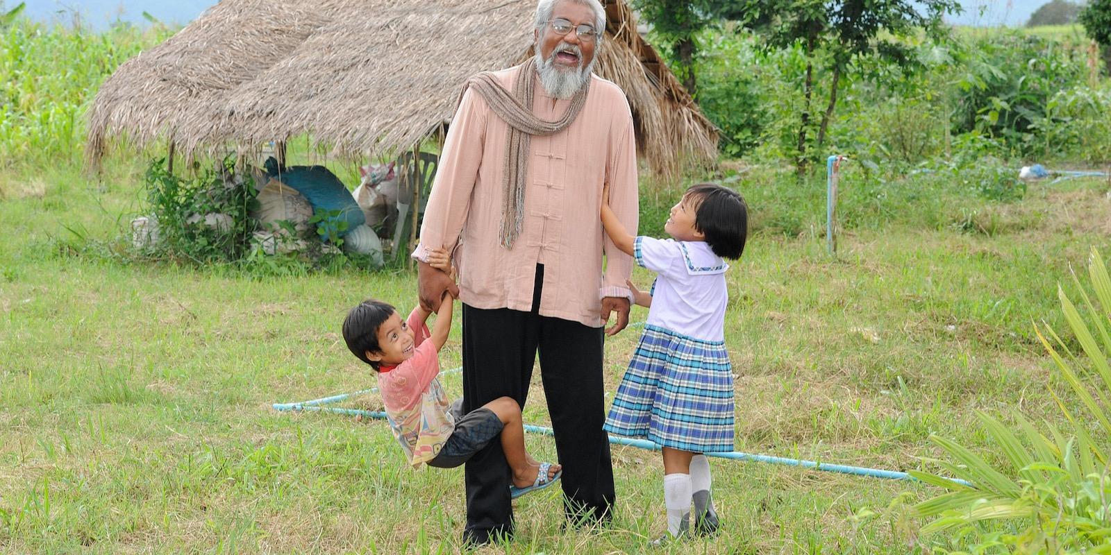 Sompop playing with kids