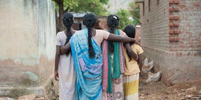 Mother and three daughters seen from behind