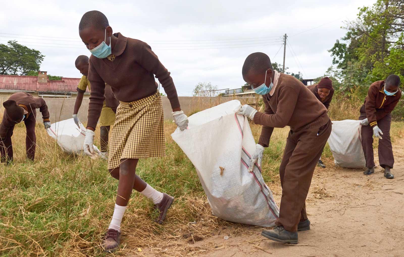 Kids collecting trash